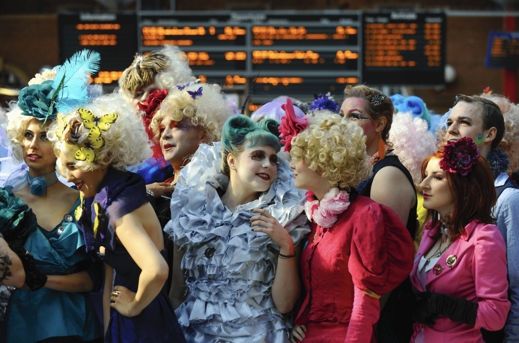 Capitol citizens from The Hunger Games in extravagant costumes